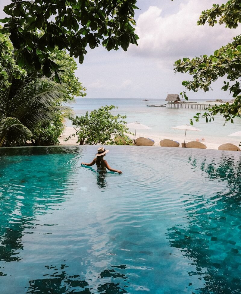 woman on body of water during daytime