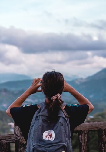 person carrying backpack